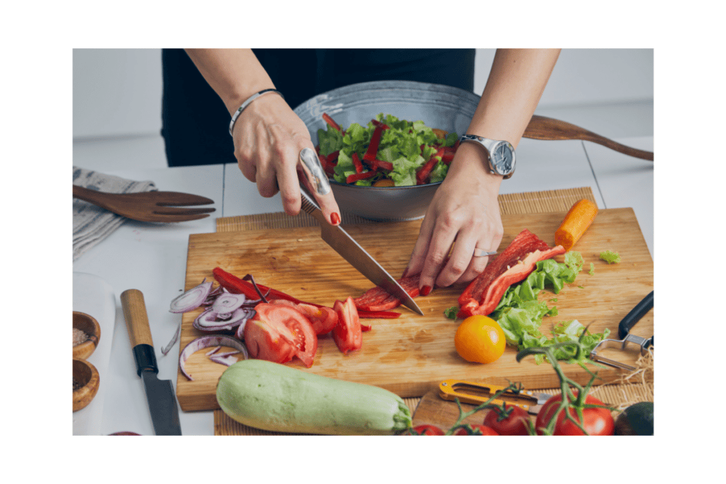 Knife skills for cooking: a person cutting vegetables on a cutting board