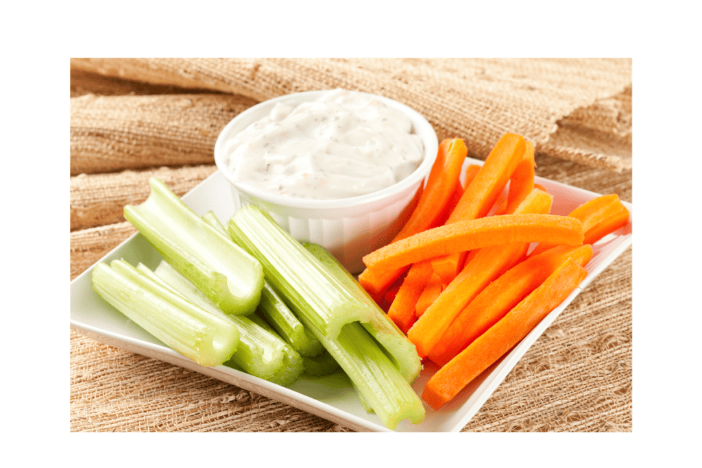 a plate of vegetables and dip